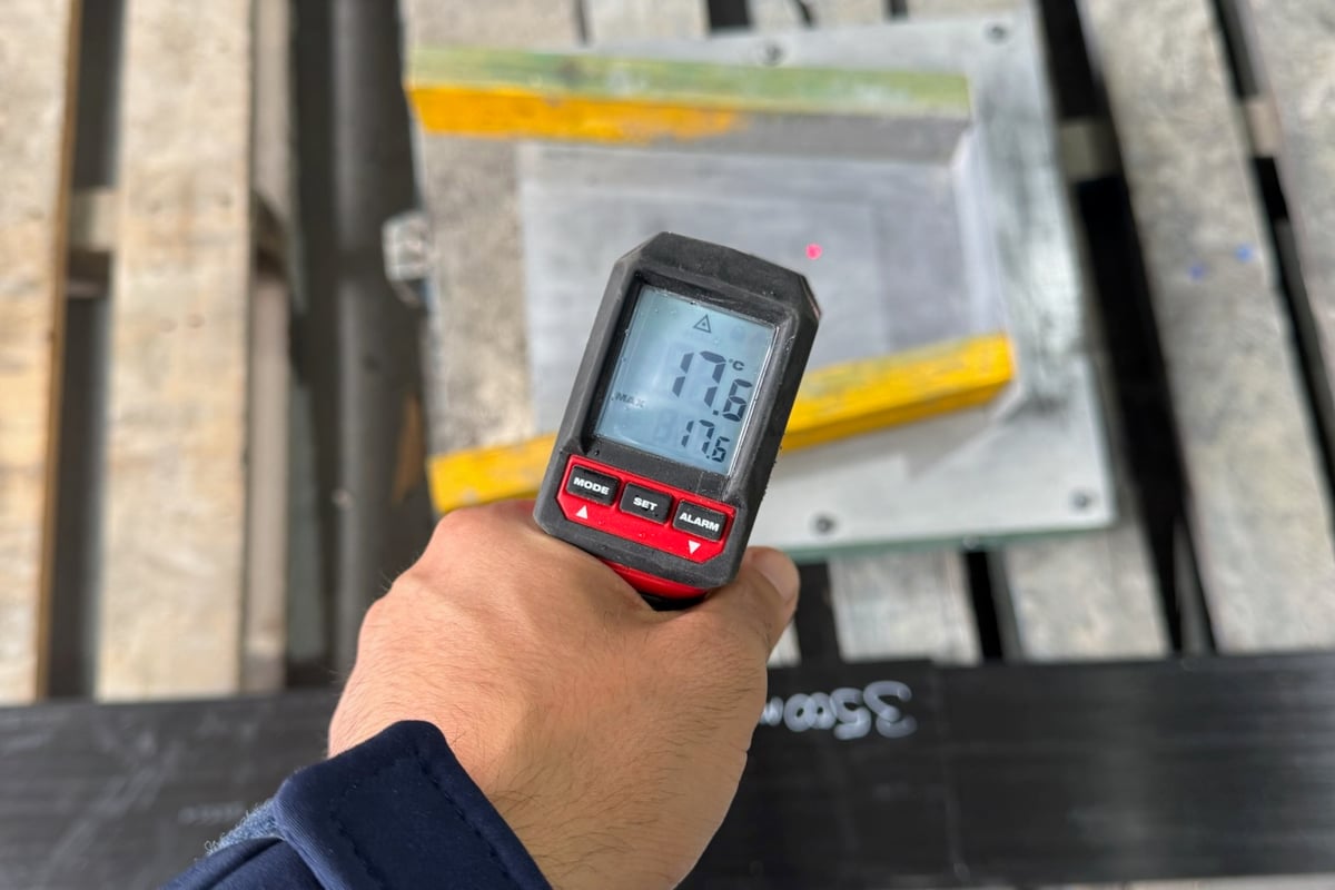 Epoxy resin application to beam surface before carbon fibre installation